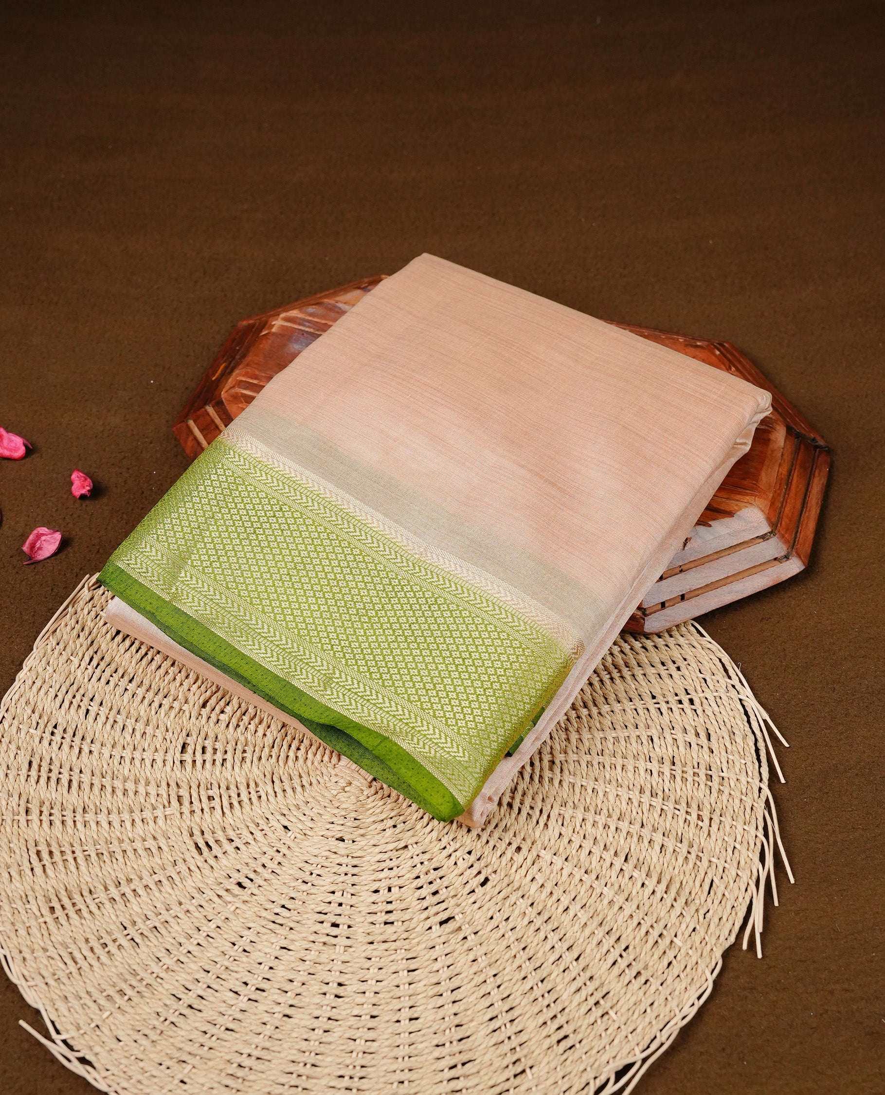 Cream colour Semi Tussar silk saree featuring an elegant plain body, accentuated by a contrast olive border adorned with intricate gold zari work, paired with a matching blouse piece.