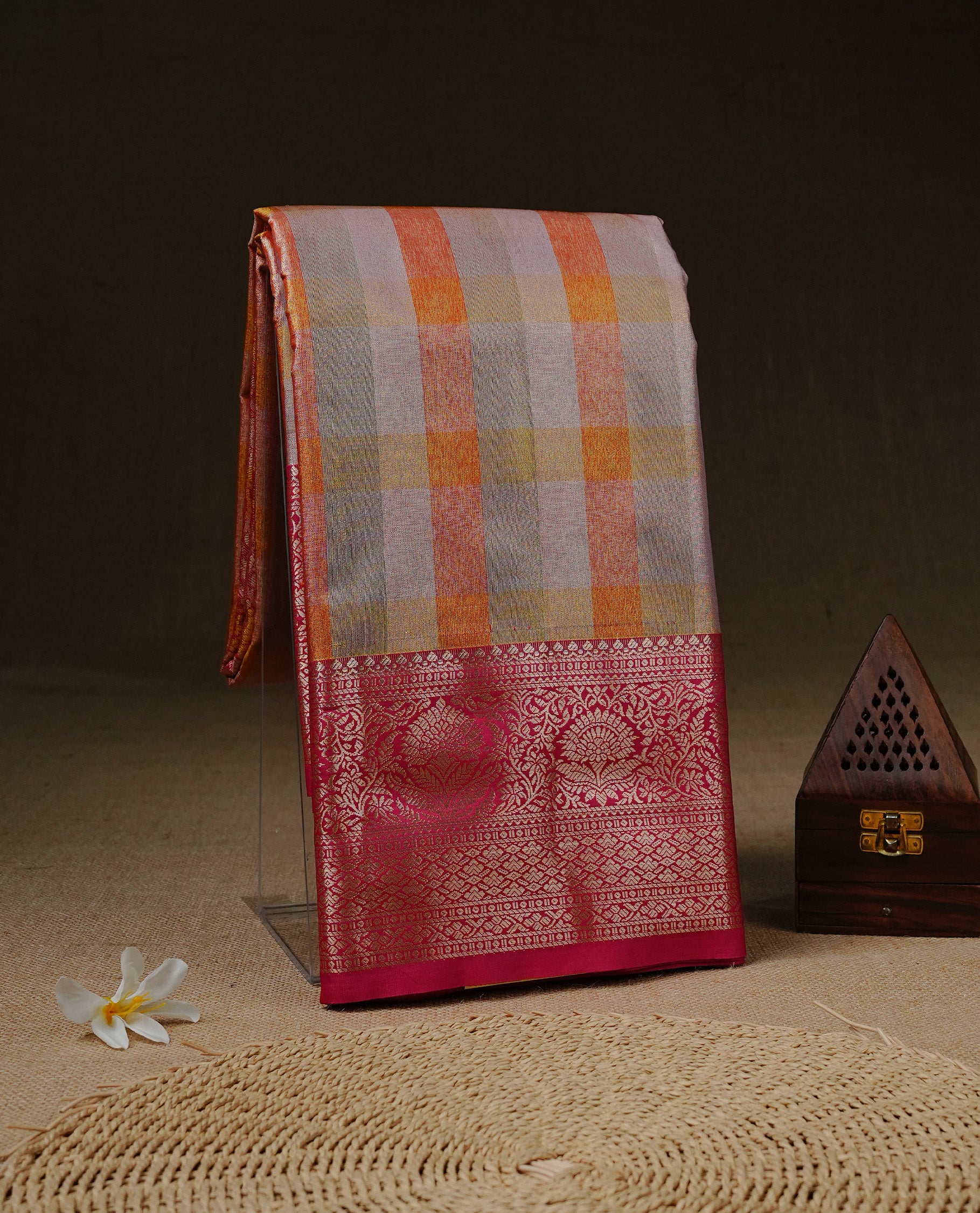 Light green, Orange & Yellow Colour Tissue Saree featuring Multi colour Check Design on body, complemented by contrast Magenta colour with Gold zari border, paired with matching blouse piece.
