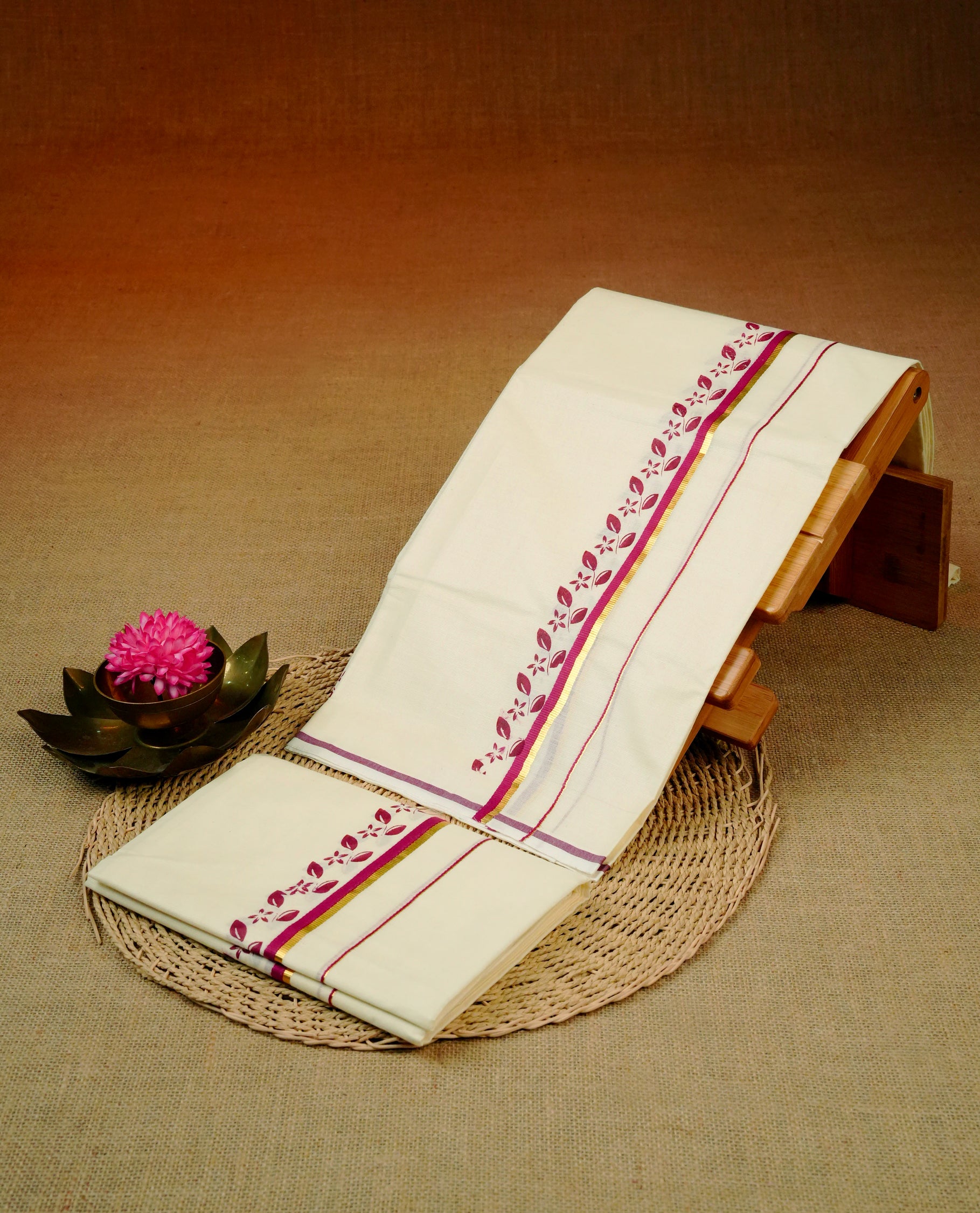 Cream colour Cotton set mundu With plain body, enhance gold zari with Maroon Leaf & floral print kara.
