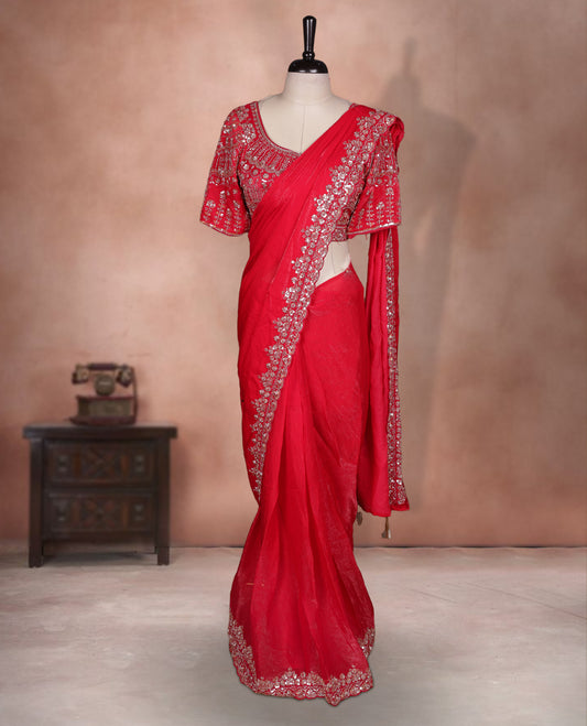 Elegant Red colour ready to wear saree adorned with rich Gold bead embroidery along the border and pallu, paired with a heavily embellished matching blouse for a grand festive look.