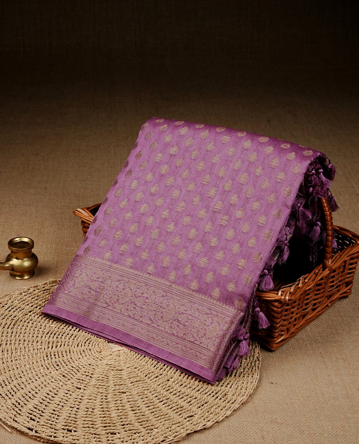 Light purple colour banaras saree featuring Gold zari buttas on body, complemented gold zari on self colour border, comes with matching blouse piece.