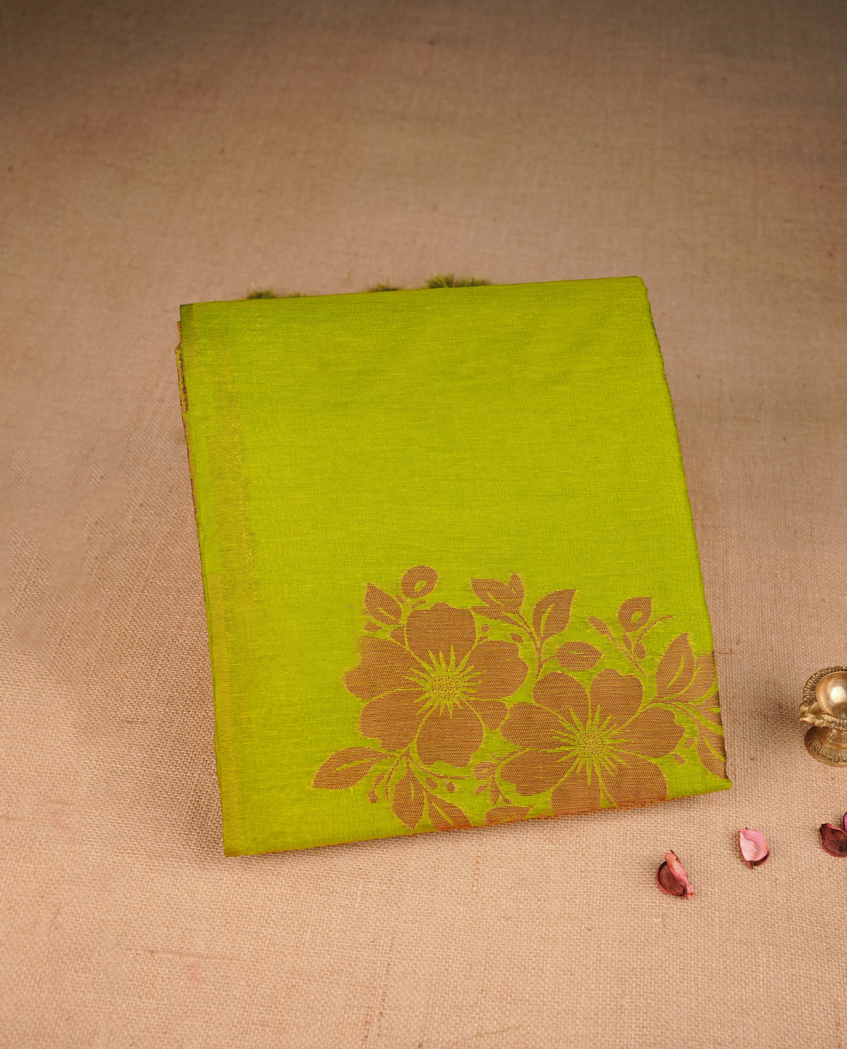 Light Green colour semi linen saree with elegant gold zari floral motifs across the body, complemented by a contrast  wine colour with grand gold zari pallu and a borderless design, paired with a matching blouse piece.