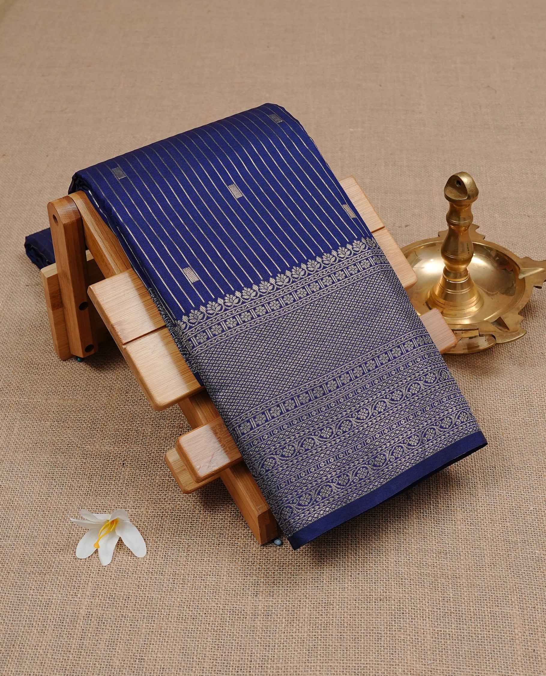 Navy Blue Semi Wedding Silk Saree featuring Gold Zari stripes Motifs On body, Complemented with traditional zari with Self colour border, paired with matching blouse piece.