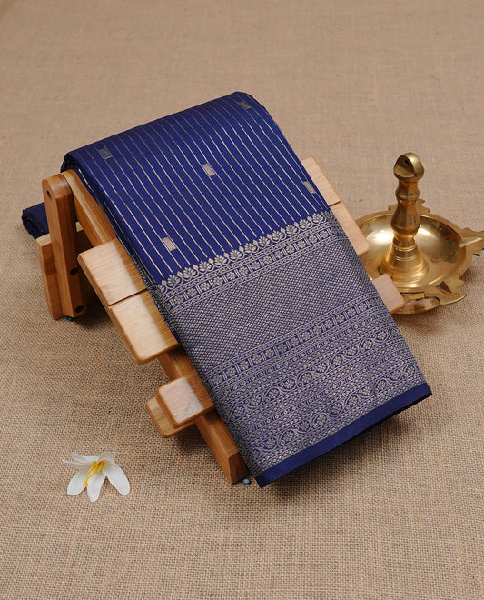 Navy Blue Semi Wedding Silk Saree featuring Gold Zari stripes Motifs On body, Complemented with traditional zari with Self colour border, paired with matching blouse piece.
