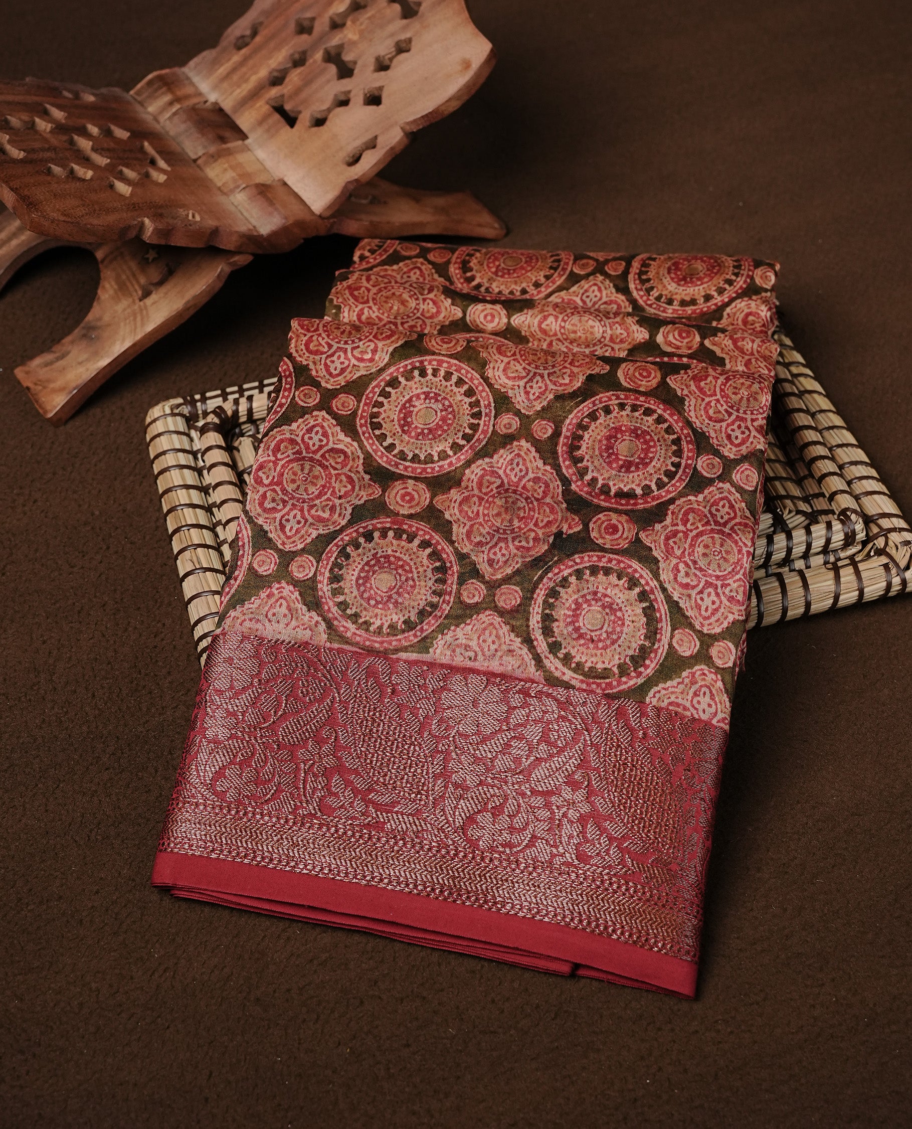 Green colour Chanderi silk saree featuring Print on body, complemented by Maroon colour with Antique zari border, paired with matching blouse piece.