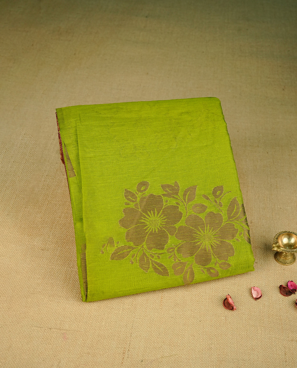 Light Green colour semi linen saree with elegant gold zari floral motifs across the body, complemented by a contrast  colour with grand gold zari pallu and a borderless design, paired with a matching blouse piece.