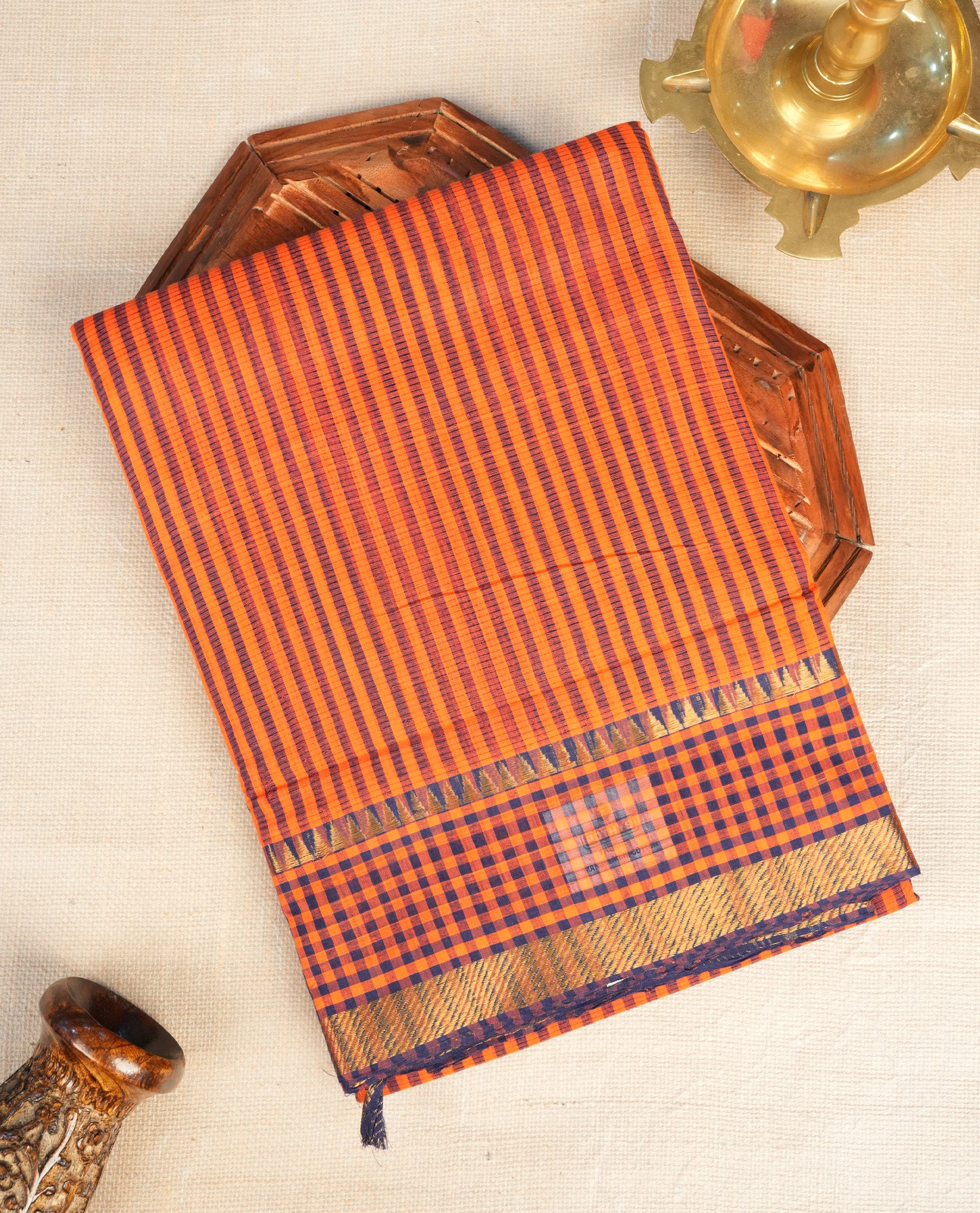 Orange Colour Mangalagiri cotton saree featuring elegant Navy Blue Strips Across The Body , Checks with  Gold  zari border & Gold Zari Pallu, Paired With a matching blouse piece.