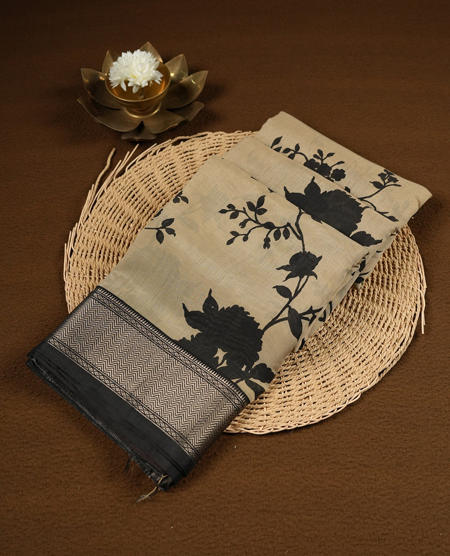 Cream colour Viscos semi printed saree featuring a contrast black light golden zari border, abstract Black printed motifs on the body, and comes with a matching blouse