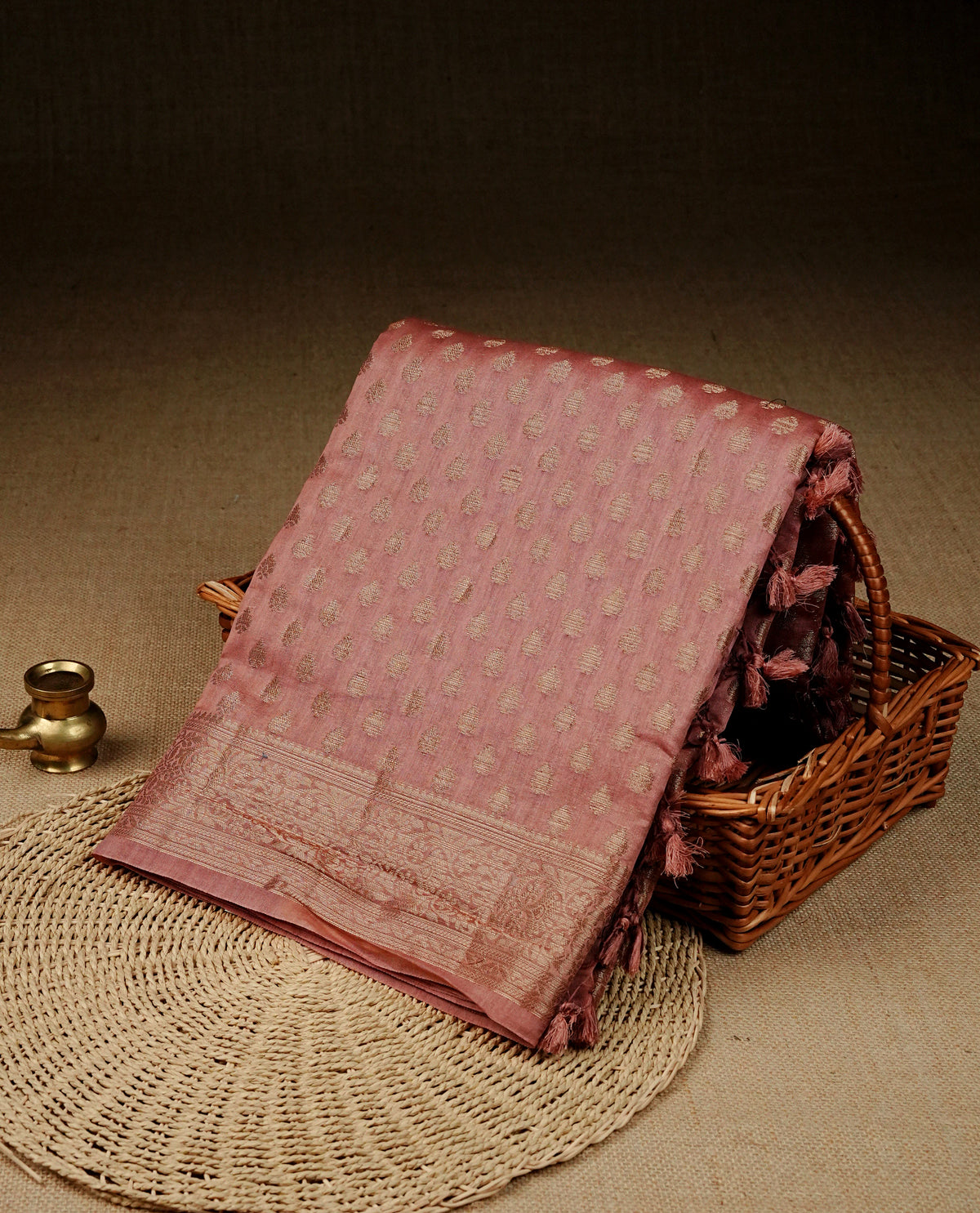 Mauve colour banaras saree featuring Gold zari buttas on body, complemented gold zari on self colour border, comes with matching blouse piece.