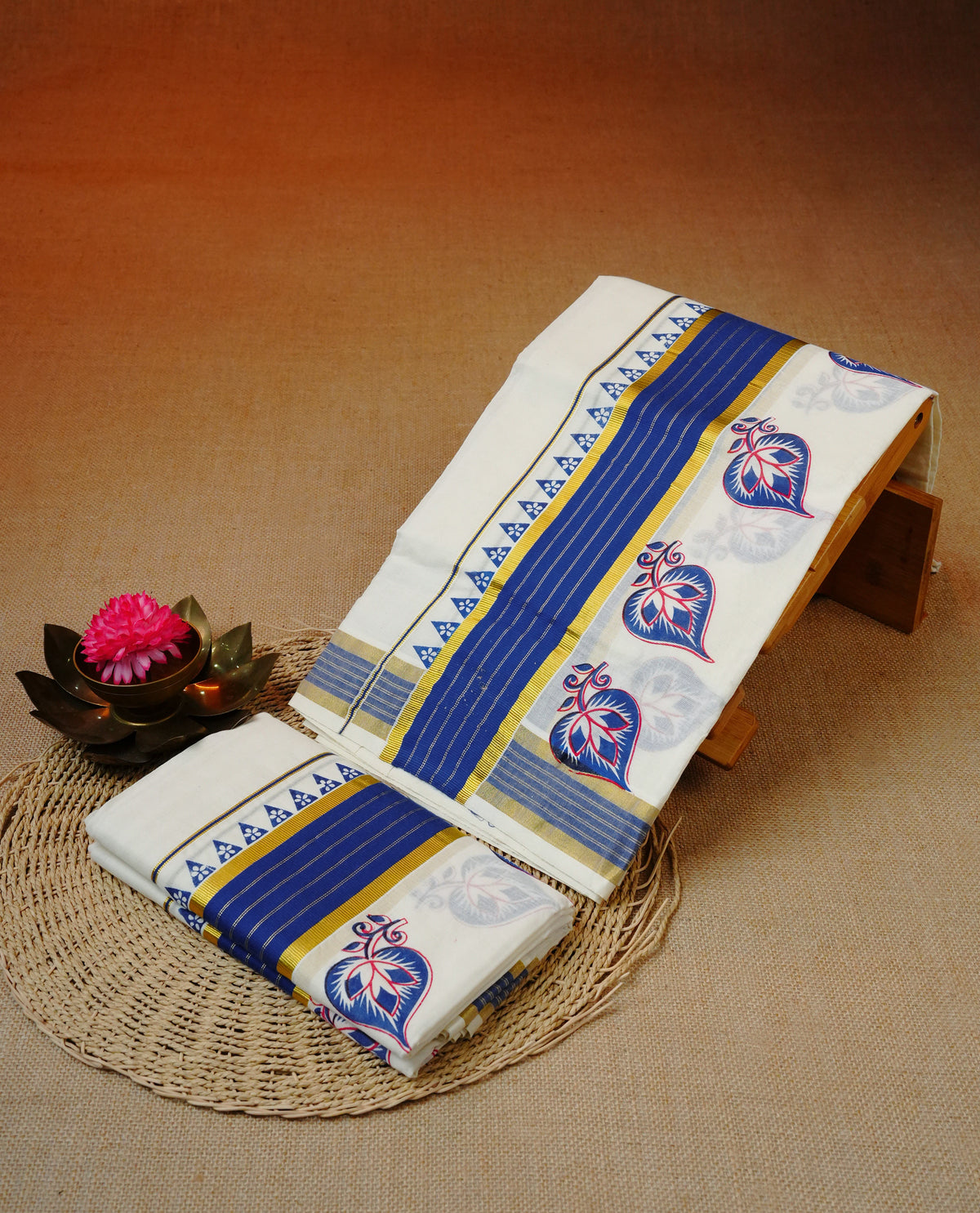 Cream colour cotton set mundu featuring Kasavu with blue kara with temple print.