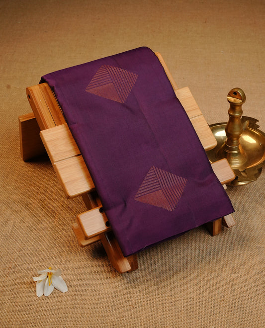Dark Purple Colour Traditional Kancheepuram Silk Saree Featuring Copper Zari Diamond Motifs on the Body, Designed Without a Border and with a Grand Pallu, Paired with a Matching Blouse.