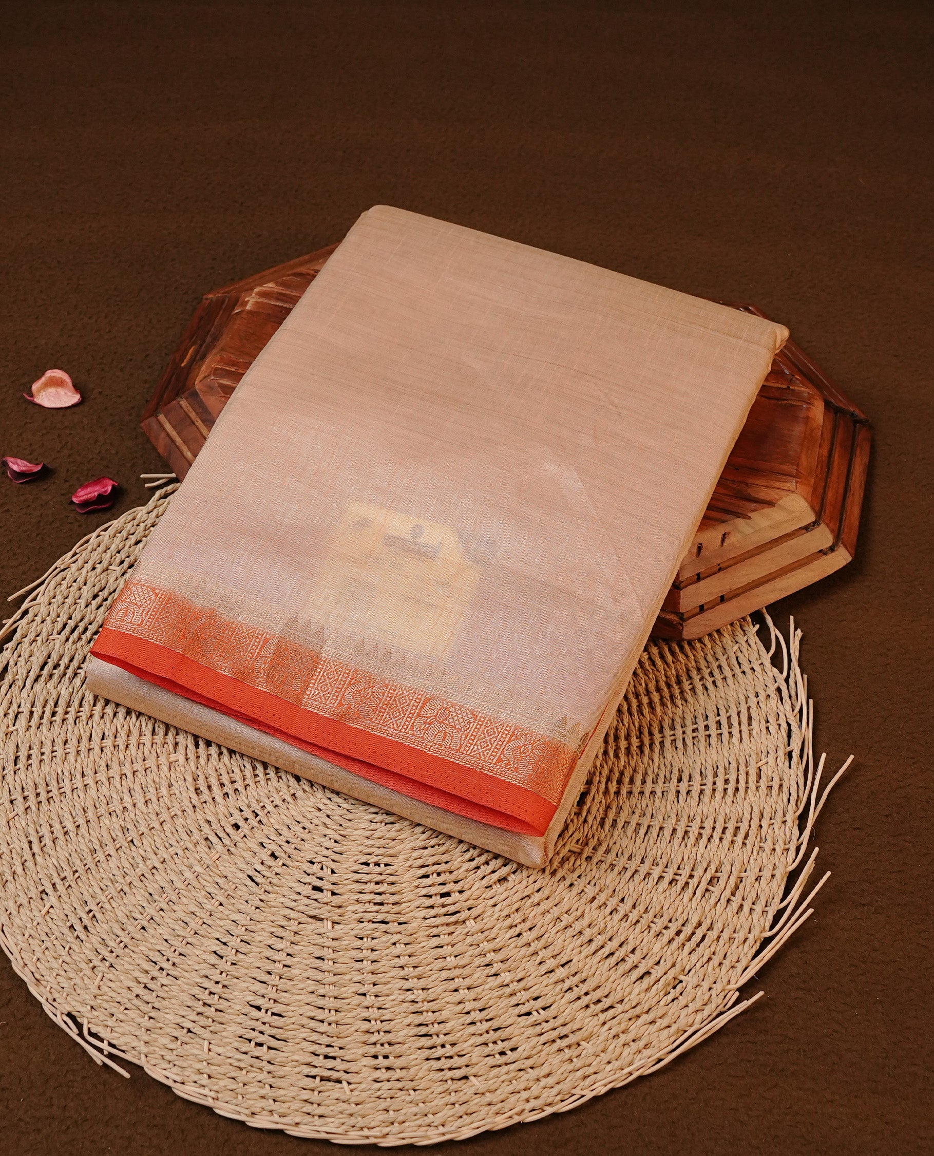 Cream colour Tussar silk saree Featuring Elegant Plain body, complemented by Contrast Orange colour with gold zari border, paired with matching blouse piece.
