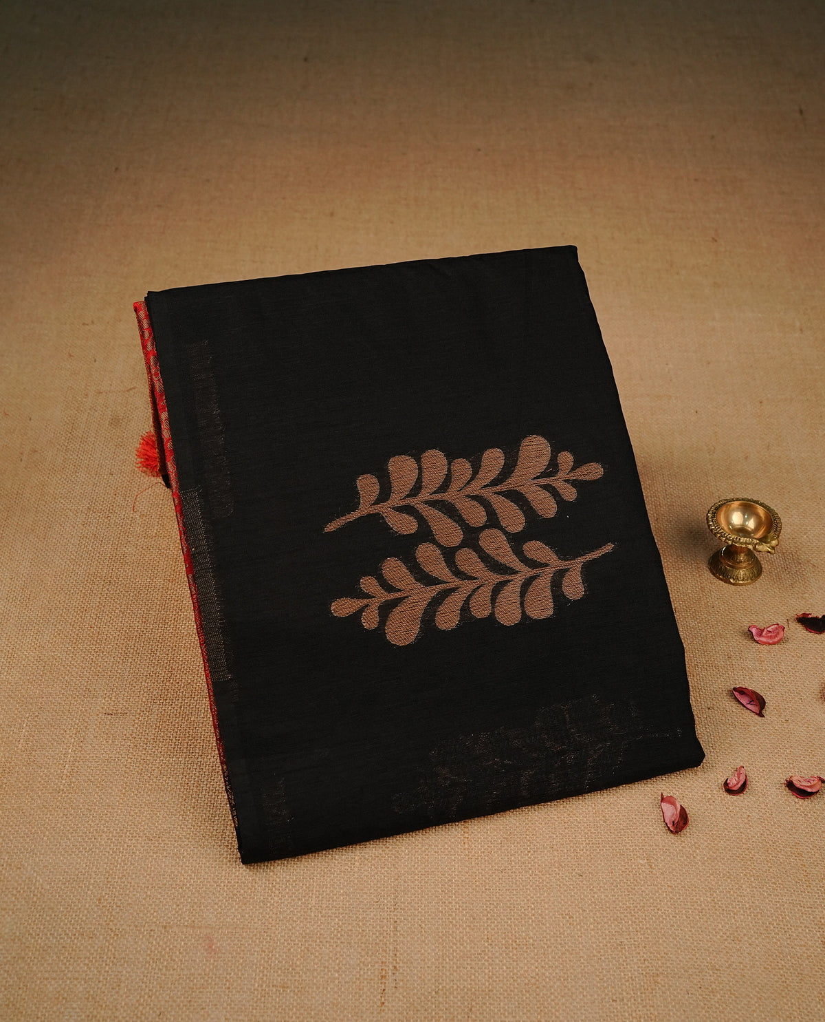 Black colour semi silk saree featuring Silver zari Floral pattern on body, complemented by contrast Pink colour with silver zari border, comes with matching blouse piece.