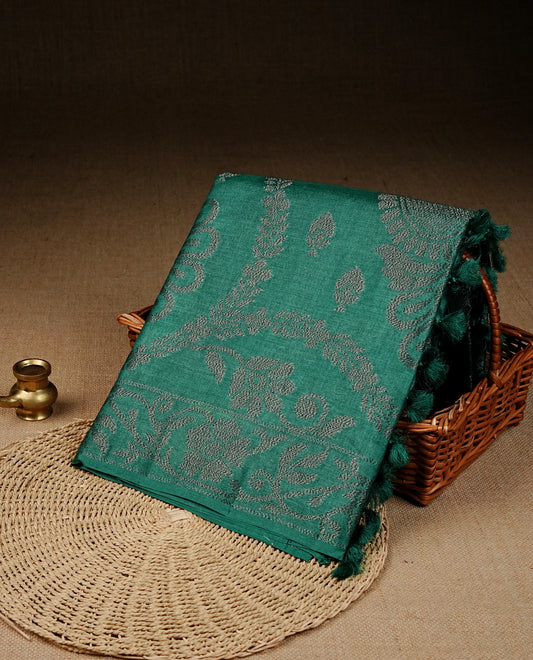Green colour banaras saree featuring Antique zari kodi pattern on body, complemented by borderless & comes with matching blouse piece.