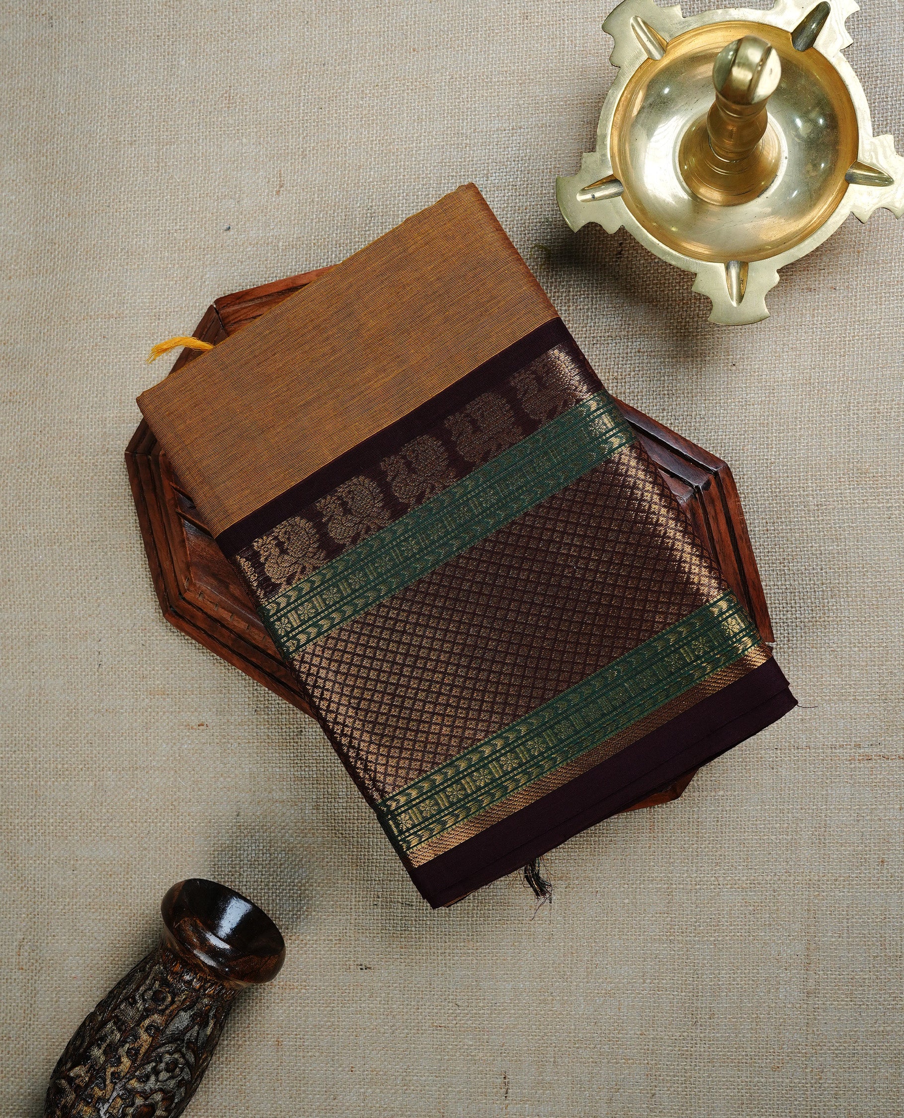 Olive colour chettinad cotton saree featuring  Plain  body, complemented by Contrast Brown & Green Colour With Gold Zari border, paired with matching blouse piece.