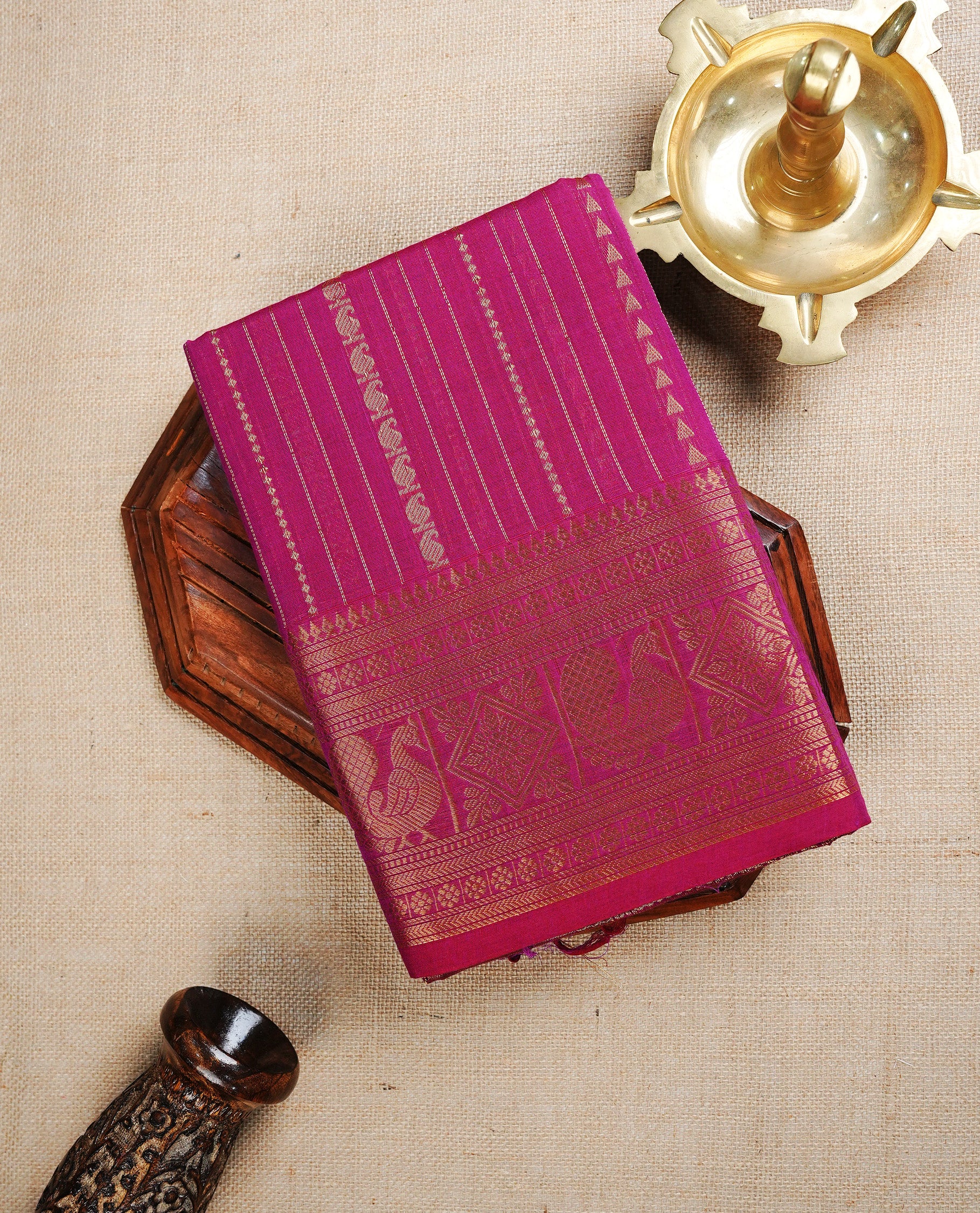 Magenta colour chettinad cotton saree featuring Gold Zari Stripes on body, complemented by Contrast Colour With Traditional  Gold Zari border, paired with matching blouse piece.