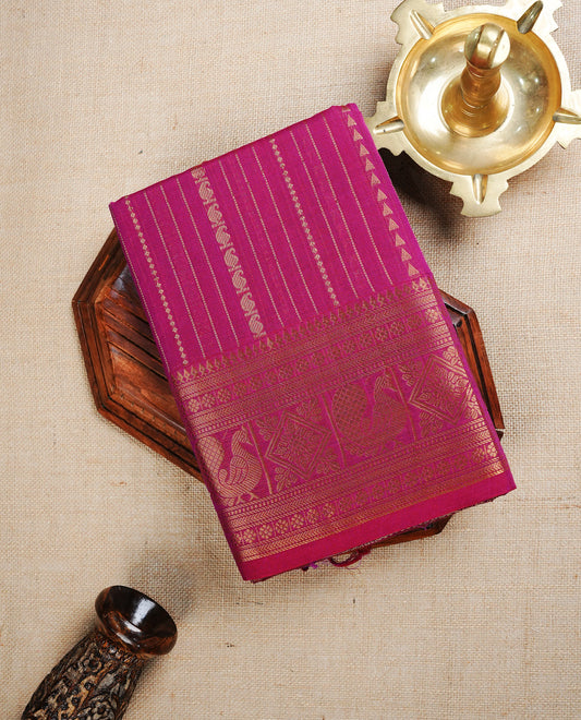 Magenta colour chettinad cotton saree featuring Gold Zari Stripes on body, complemented by Contrast Colour With Traditional  Gold Zari border, paired with matching blouse piece.