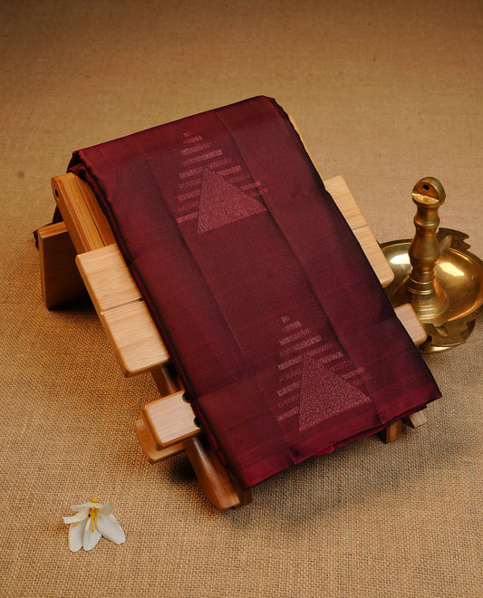 Wine Colour Traditional Kancheepuram Silk Saree Featuring Light Gold  Zari Triangle  Motifs on the Body, Designed Without a Border and with a Grand Pallu, Paired with a Matching Blouse.