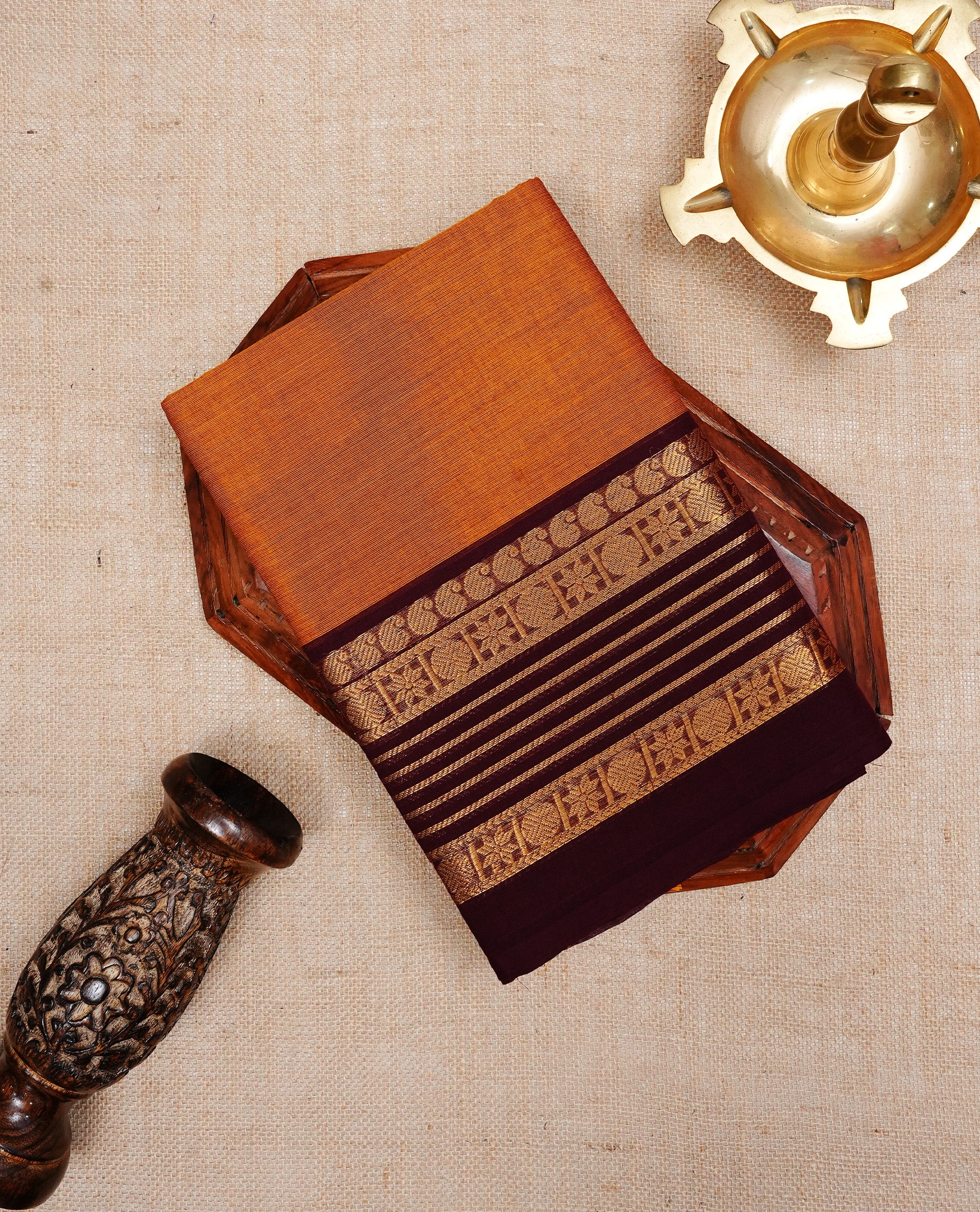Mustard colour chettinad cotton saree featuring Elegant plain body, complemented by contrast Dark chocolate  colour with Gold zari border, paired with matching blouse piece.