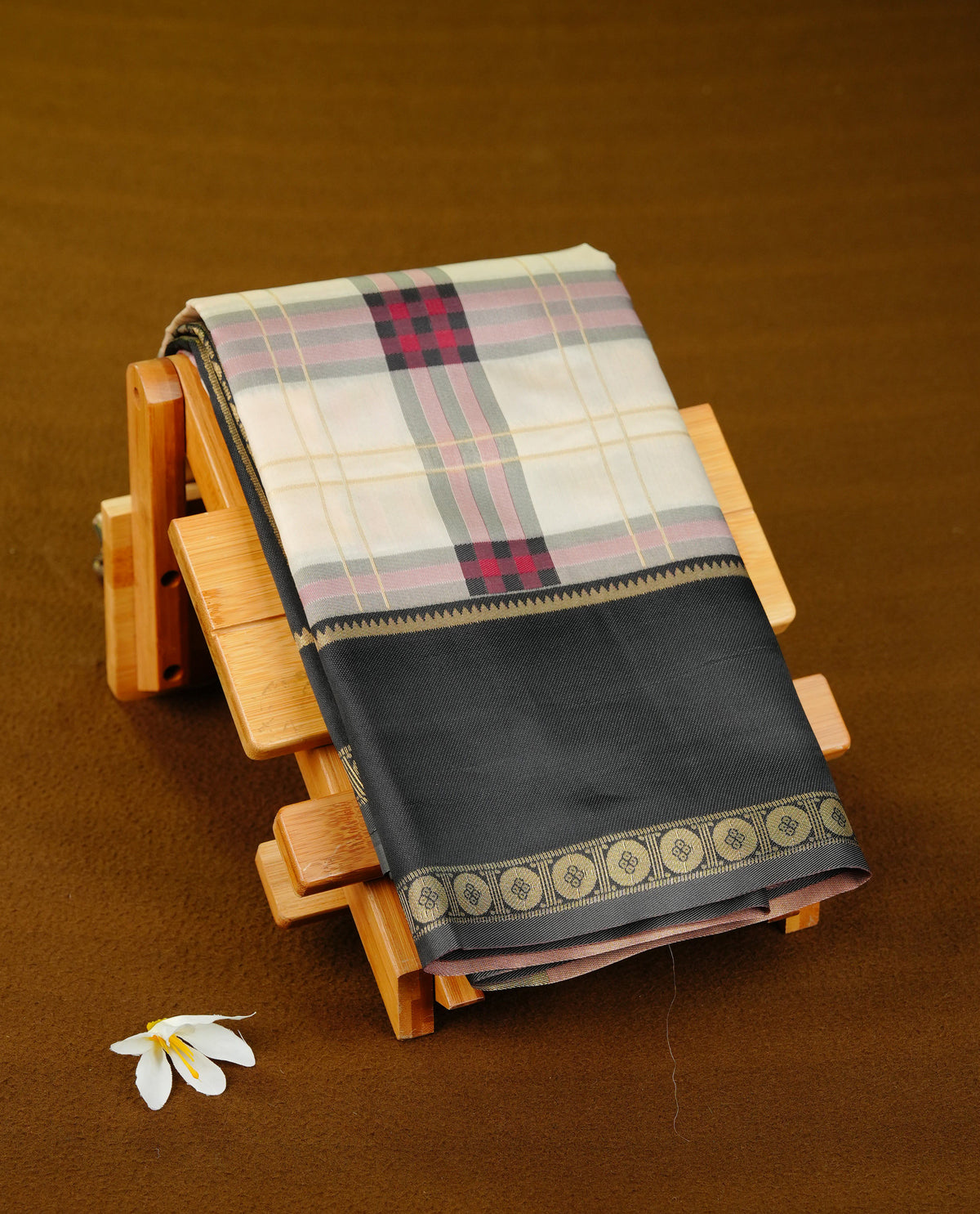 Cream colour soft silk saree with contrast Black border.