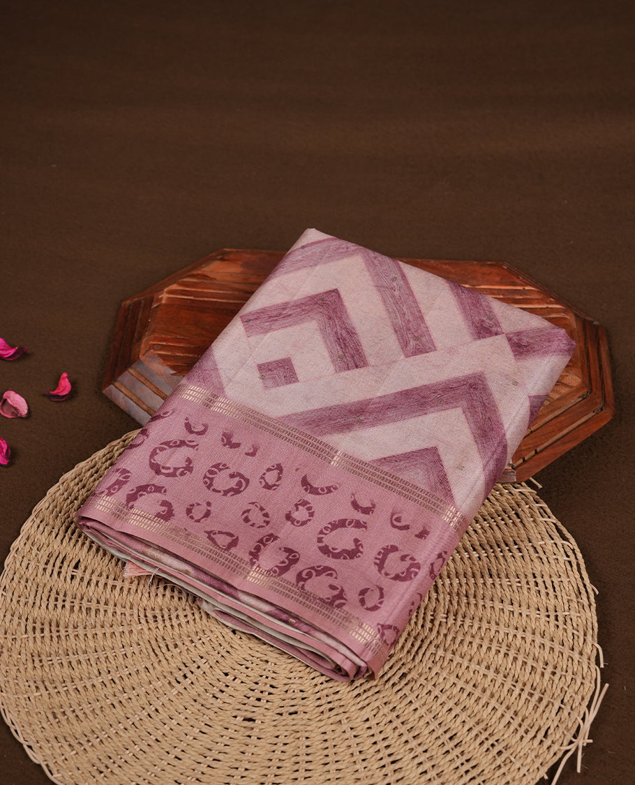 Mauve colour semi tusser silk saree featuring geometric print pattern across body, gold zari border with style motifs and paired with matching blouse.