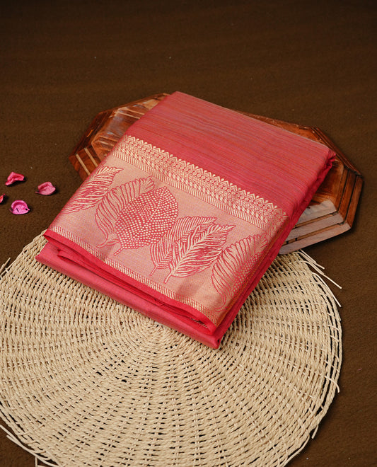 Red colour semi tussar silk saree featuring an elegant plain body with traditional gold zari detailed border for a refined look. Comes paired with a matching blouse piece.