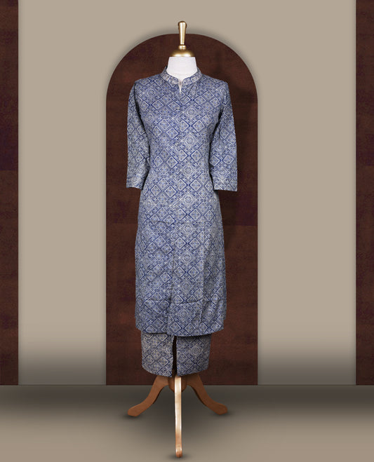 Dusky blue colour cord set with geometric white prints, Features a straight fit kurta with a mandarin collar, button down front, and 3/4 sleeves, paired with matching straight pants for a stylish ethnic look.