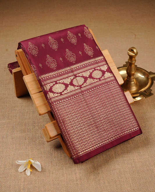 Wine Colour Pure Kancheepuram Silk Saree Featuring Gold Zari  Motifs on the Body, Highlighting a Traditional Gold Zari Border, Paired with a Matching Blouse Piece.