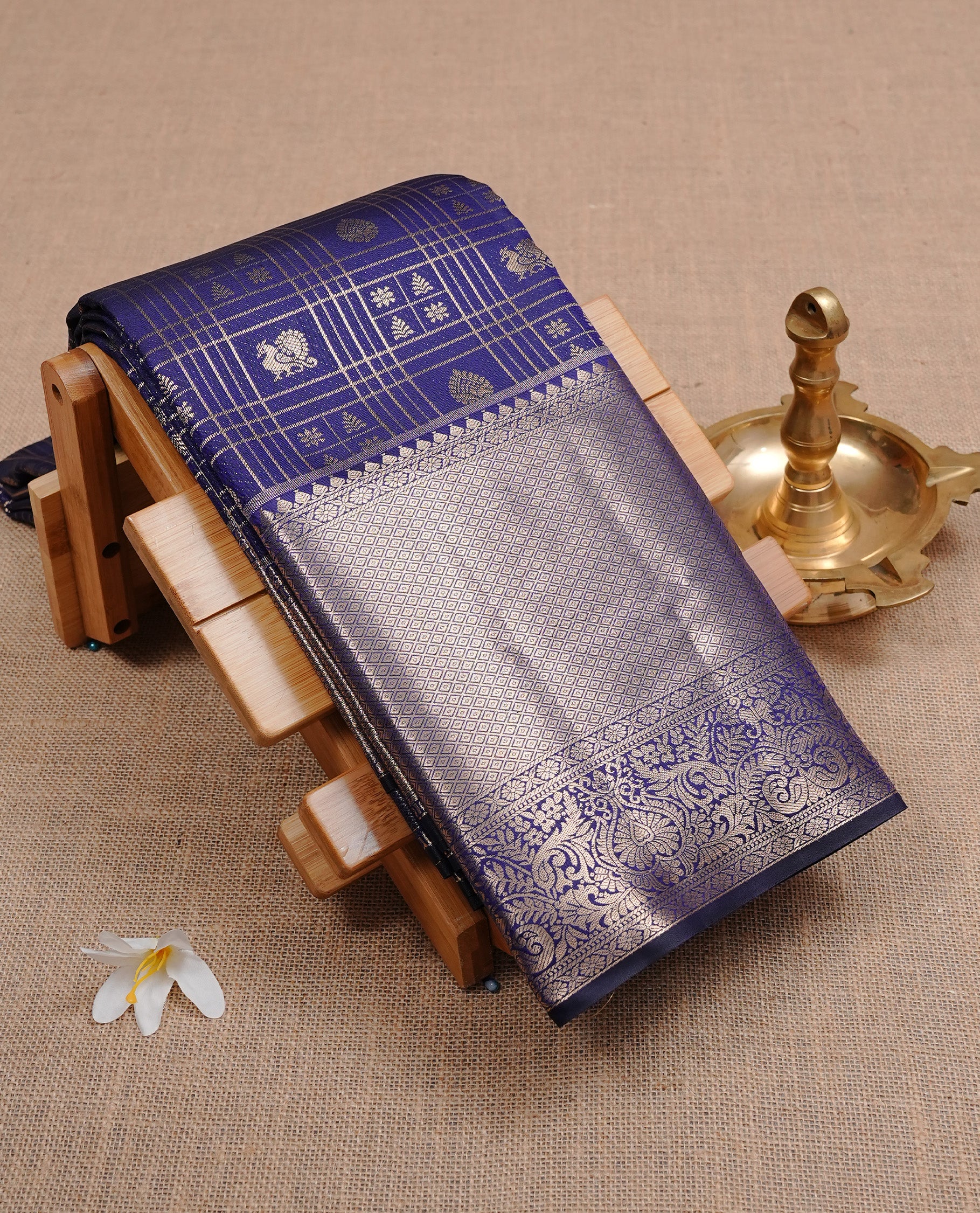 Navy Blue Semi Wedding Silk Saree featuring Gold Zari Check with Motifs On body, Complemented with traditional zari with Self colour border, paired with matching blouse piece.