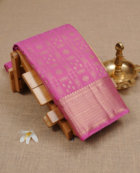 Pink Semi Wedding Silk Saree featuring Gold Zari Check with Motifs On body, Complemented with traditional zari with Self colour border, paired with matching blouse piece.