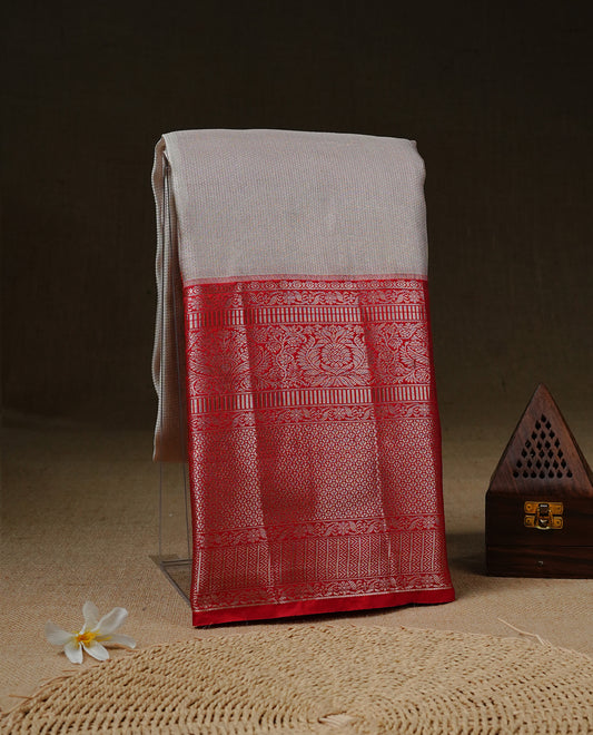 Off white colour Net Tissue saree Elegant plain body, complemented by Red colour with Light gold zari long traditional border, paired  with matching blouse piece.