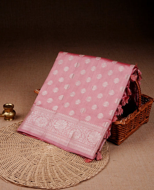Light Pink colour banaras saree featuring silver zari buttas on body, complemented silver zari on self colour border, comes with matching blouse piece.