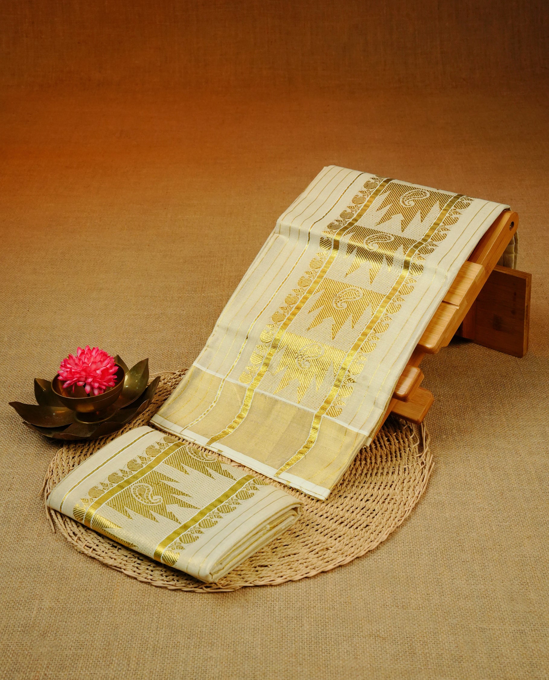 Cream Colour tissue set mundu featuring a Striped body, enhanced with Gold Zari Design & gold zari kara.