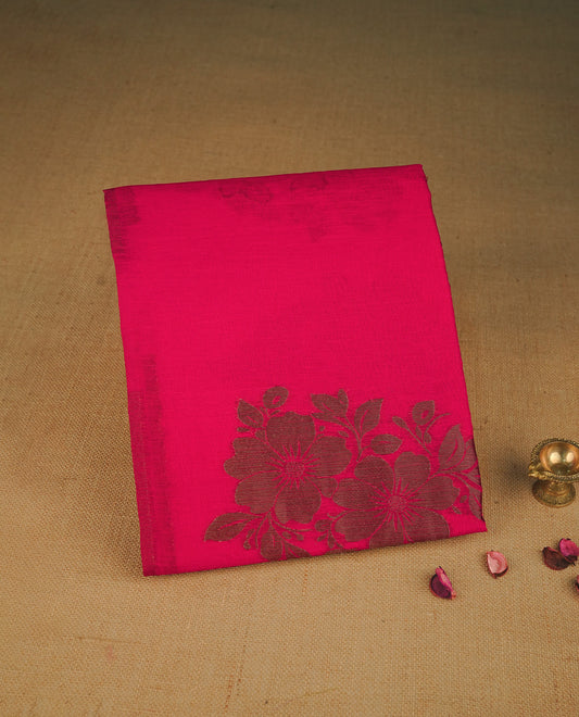Rani pink colour semi linen saree with elegant gold zari floral motifs across the body, complemented by a contrast colour with grand gold zari pallu and a borderless design, paired with a matching blouse piece.