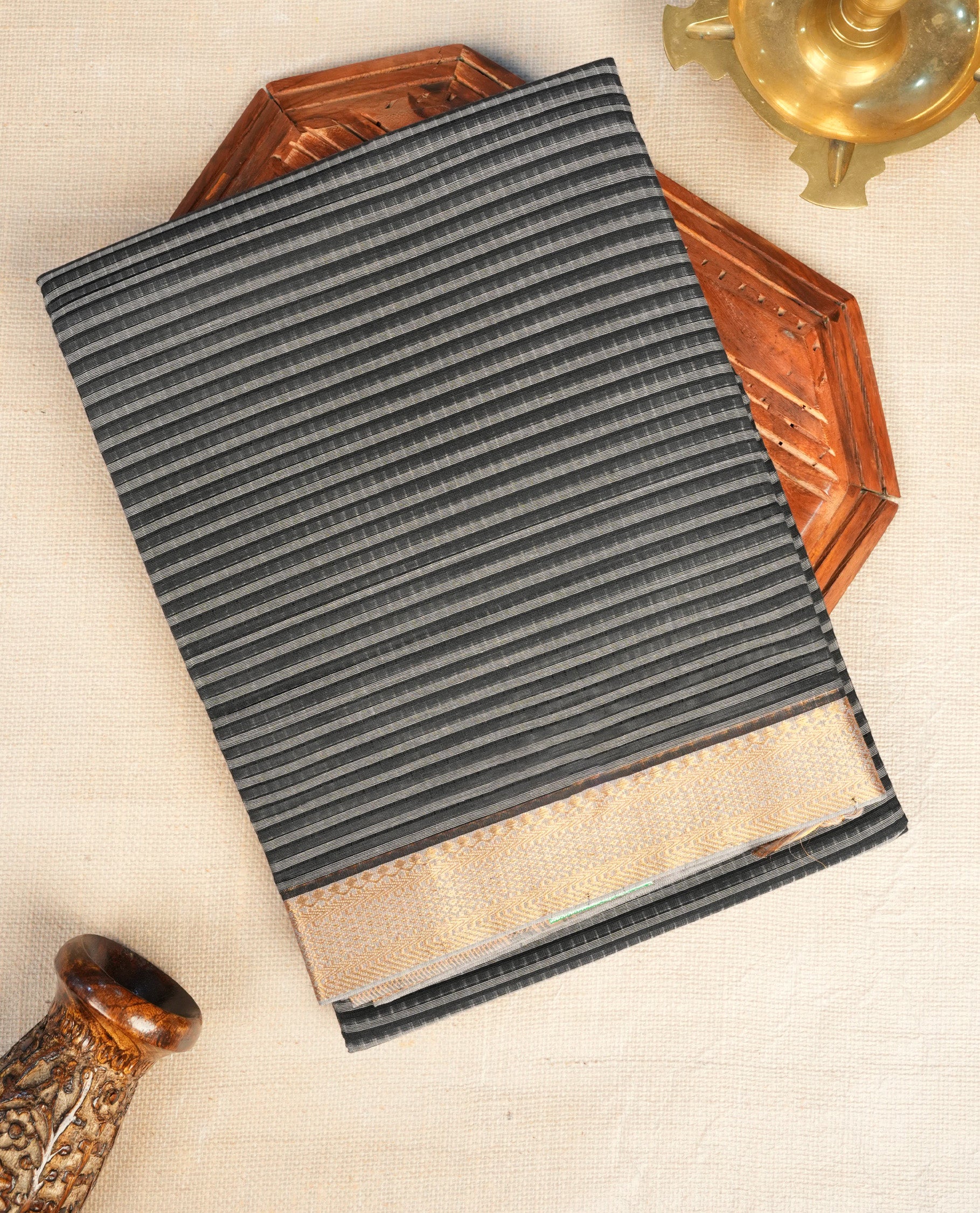 Grey  Colour Mangalagiri cotton saree featuring elegant Black stripes Across The Body , a Two Inch Gold  zari border & Gold Zari Pallu, Paired With a matching blouse piece.