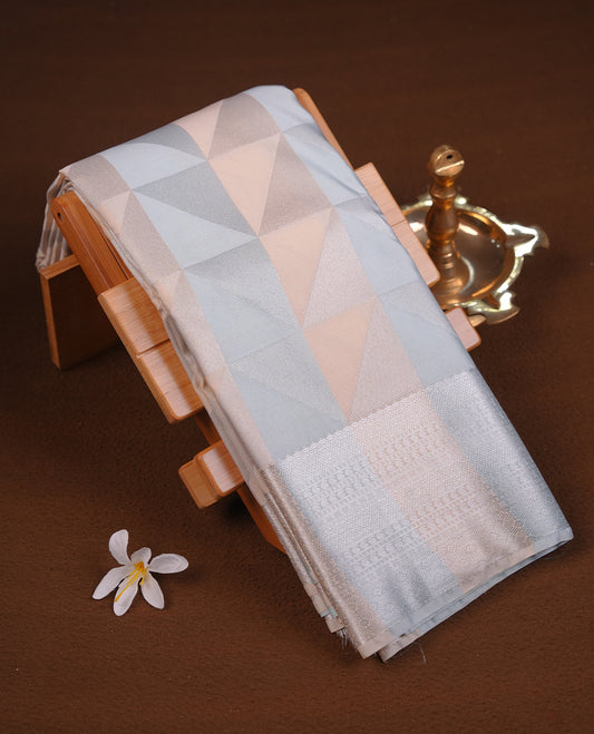 Ice blue & cream colour semi soft silk saree featuring a silver zari patterned body, complemented by silver zari motifes on pallu & border and a matching blouse piece.