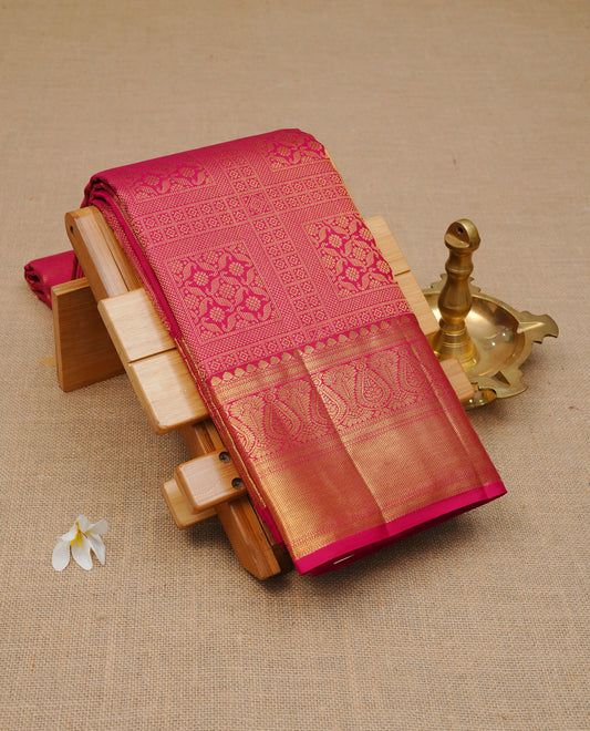Magenta colour pure wedding silk saree featuring gold zari box Designed pattern on body, comeplemented by self colour with traditional border, comes with matching blouse piece.