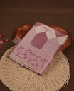 Mauve colour semi tusser silk saree featuring geometric print pattern across body, gold zari border with style motifs and paired with matching blouse.