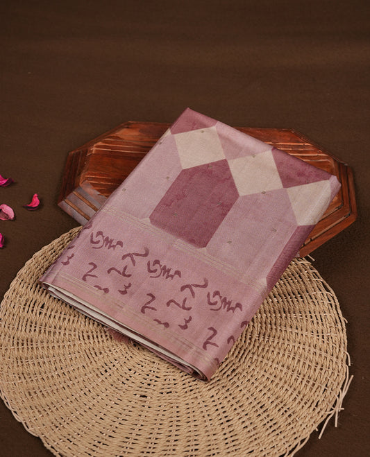 Mauve colour semi tusser silk saree featuring geometric print pattern across body, gold zari border with style motifs and paired with matching blouse.