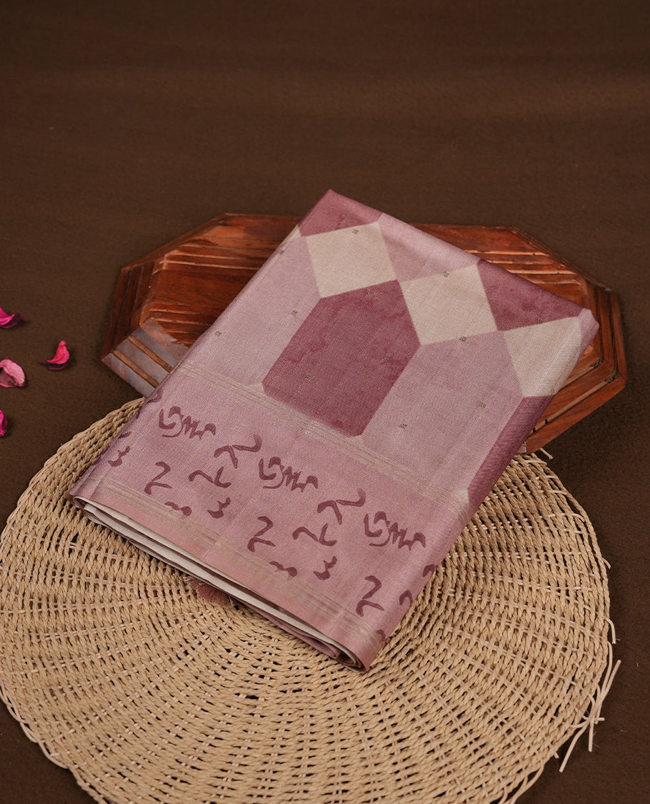 Mauve colour semi tusser silk saree featuring geometric print pattern across body, gold zari border with style motifs and paired with matching blouse.