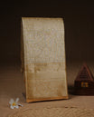 Golden Cream colour Semi Tissue silk saree featuring Gold zari kodi pattern on body, complemented by traditional border with self colour, paired with matching blouse piece.