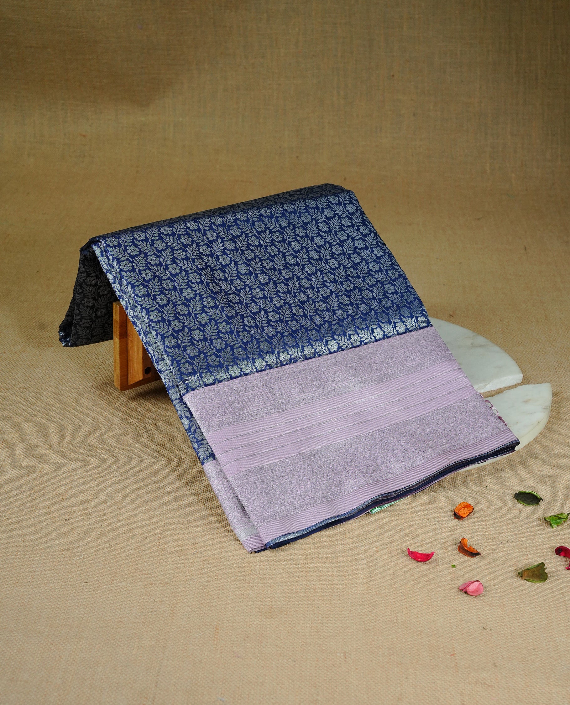 Navy blue colour semi silk saree featuring Silver zari pattern on body, complemented by contrast Pink colour with silver zari border, comes with matching blouse piece.