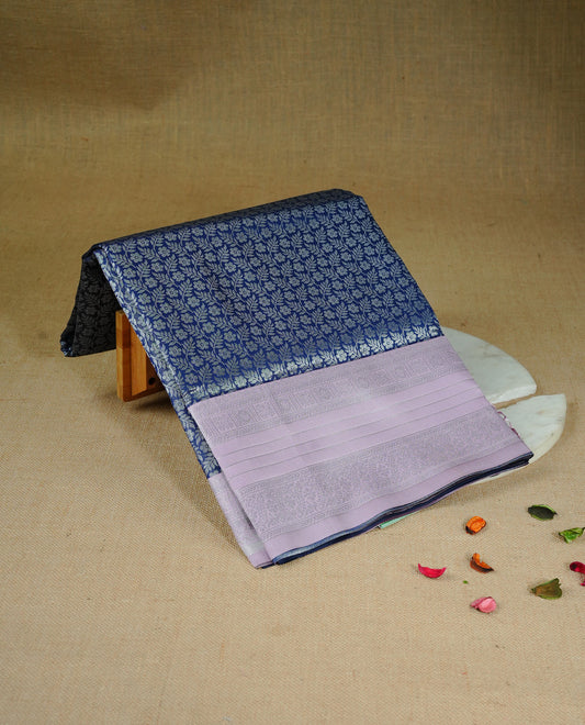 Navy blue colour semi silk saree featuring Silver zari pattern on body, complemented by contrast Pink colour with silver zari border, comes with matching blouse piece.