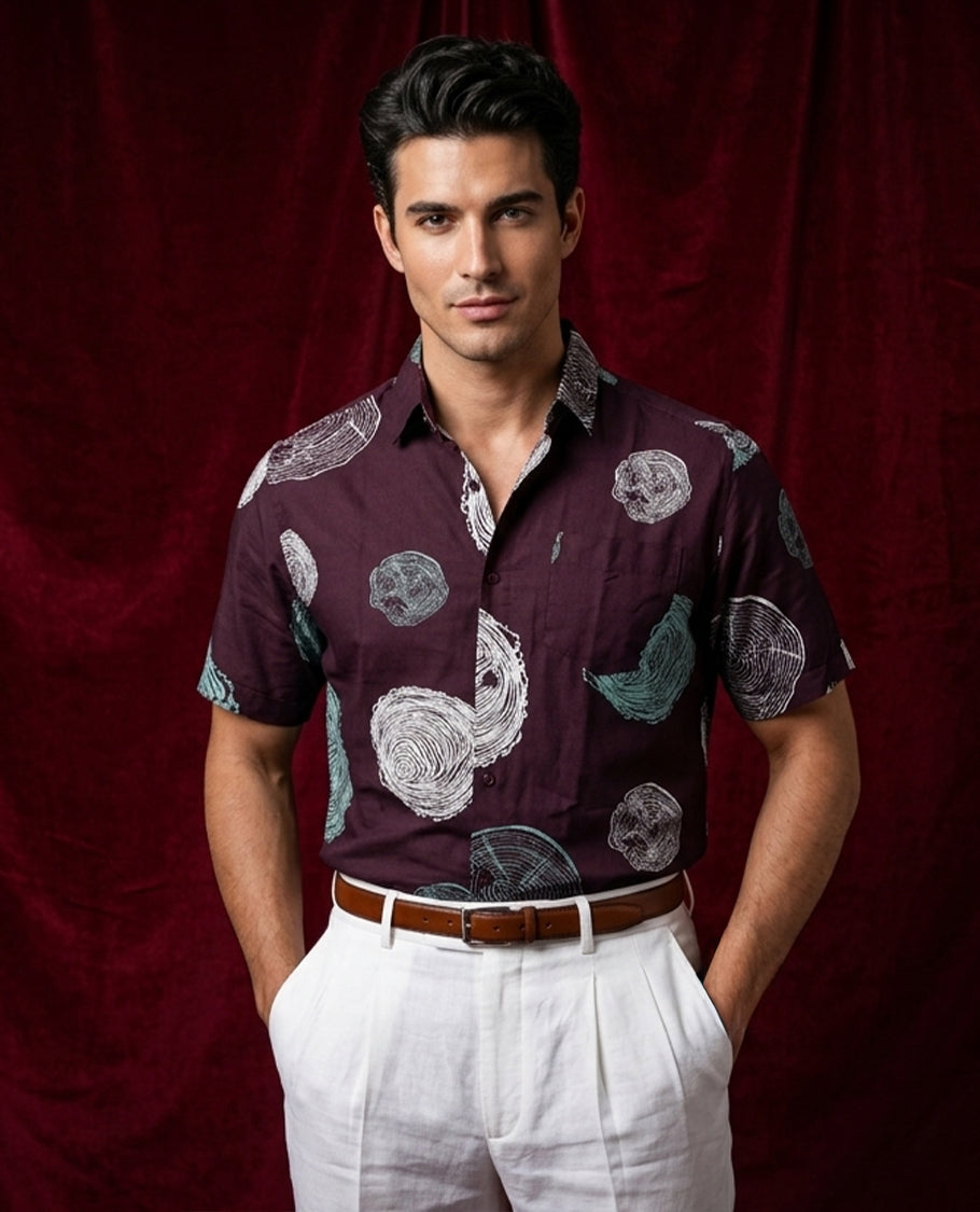 Grape colour shirt designed with white & green colour print, adored with half sleeve.