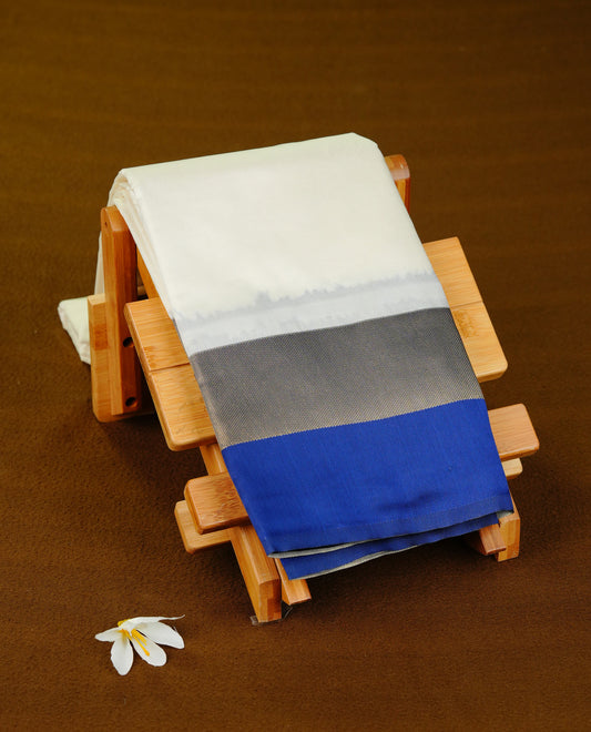 Off White colour soft silk saree with contrast Blue border.