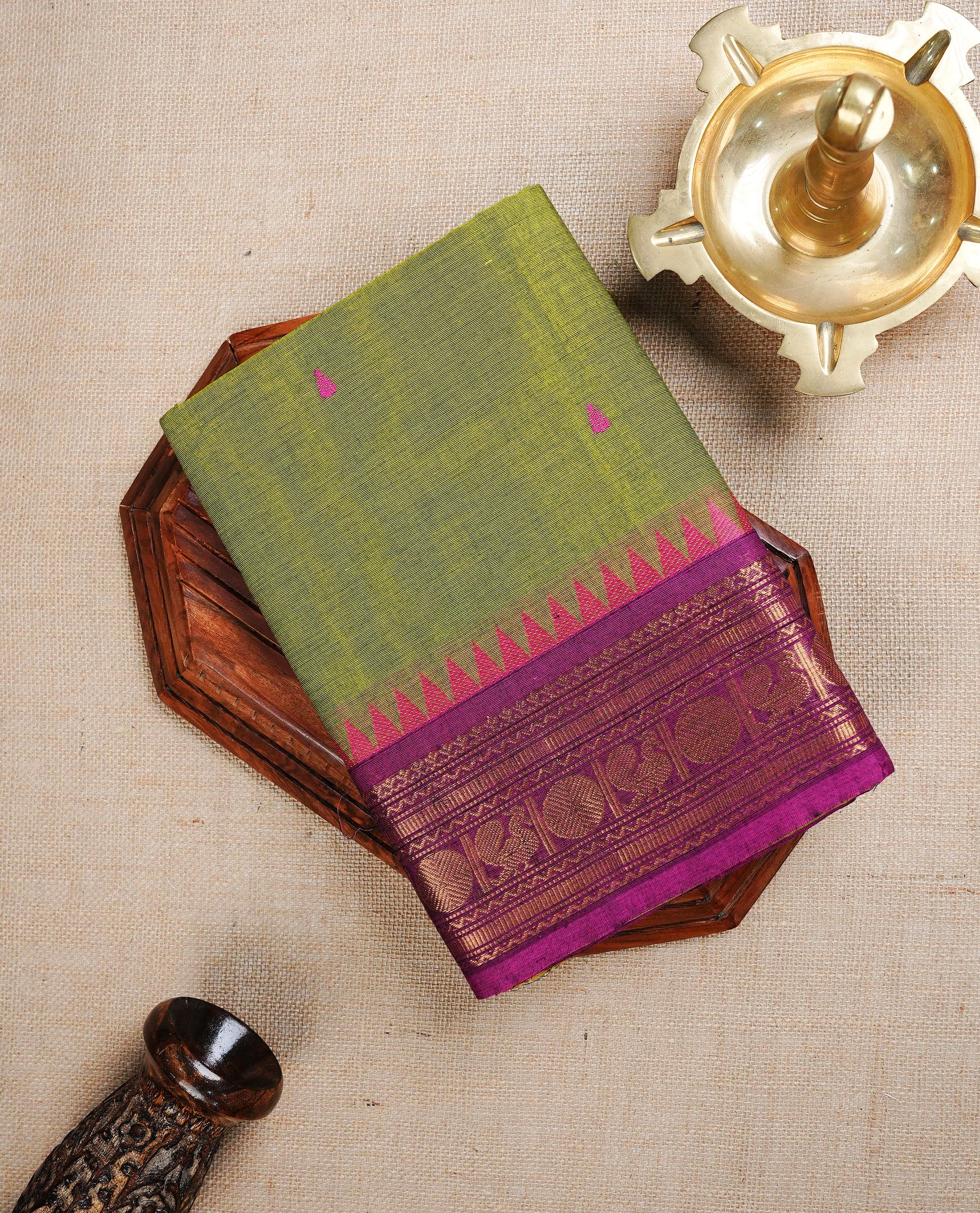 Lemon colour Chettinad cotton saree featuring Magenta Motifs, complemented by contrast magenta with gold zari border, paired with matching blouse piece.