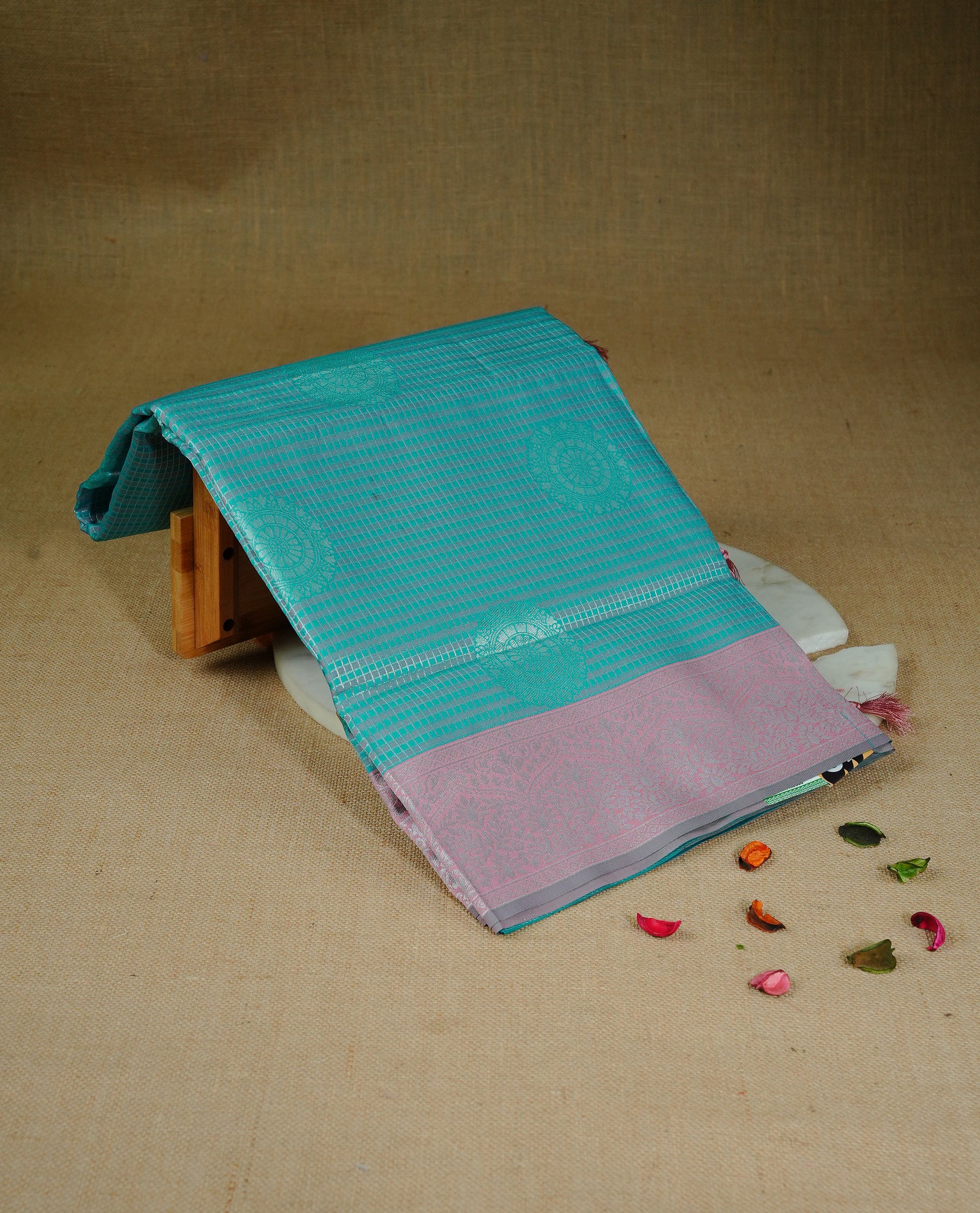 Green & peach colour semi silk saree featuring Silver zari Small check pattern & motifs on body, complemented by contrast Peach colour with silver zari border, comes with matching blouse piece.