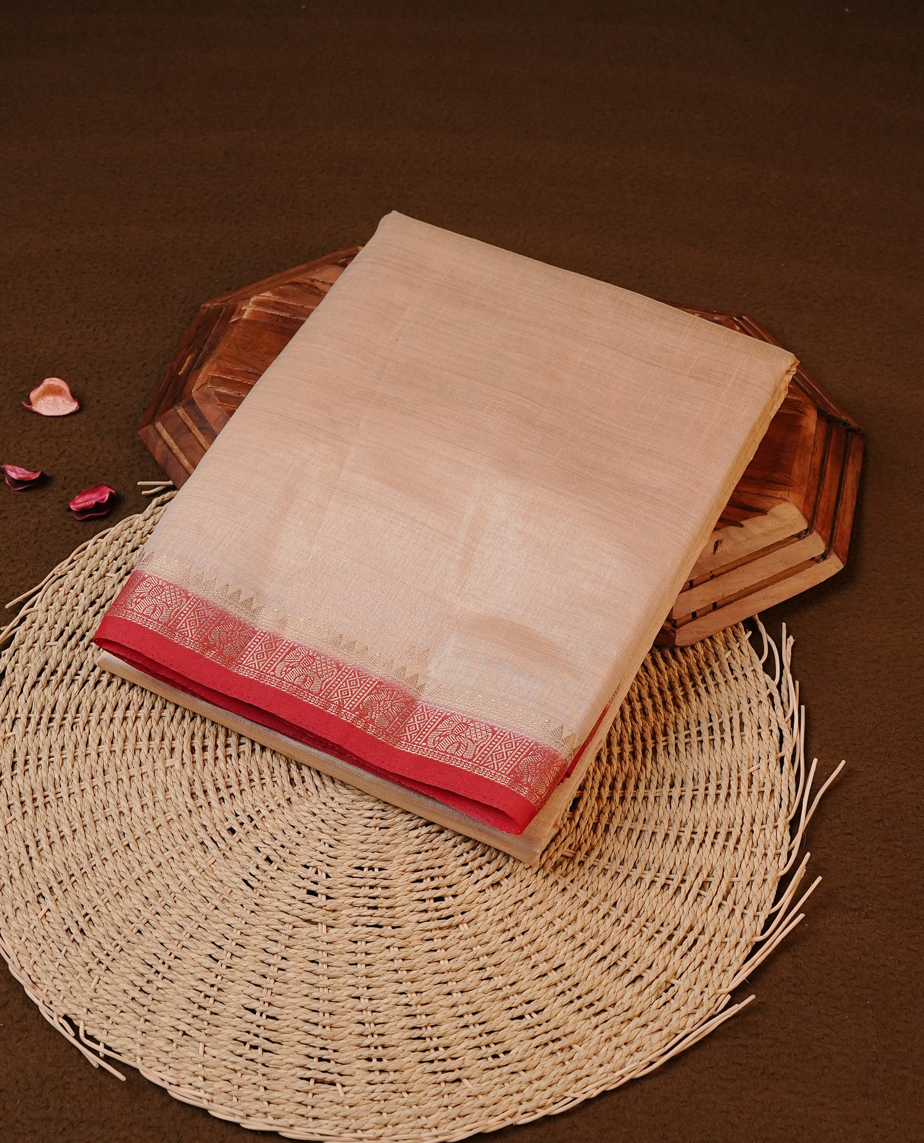 Cream colour Tussar silk saree Featuring Elegant Plain body, complemented by Contrast Red colour with gold zari border, paired with matching blouse piece.