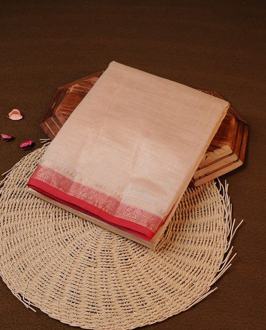 Cream colour Tussar silk saree Featuring Elegant Plain body, complemented by Contrast Red colour with gold zari border, paired with matching blouse piece.