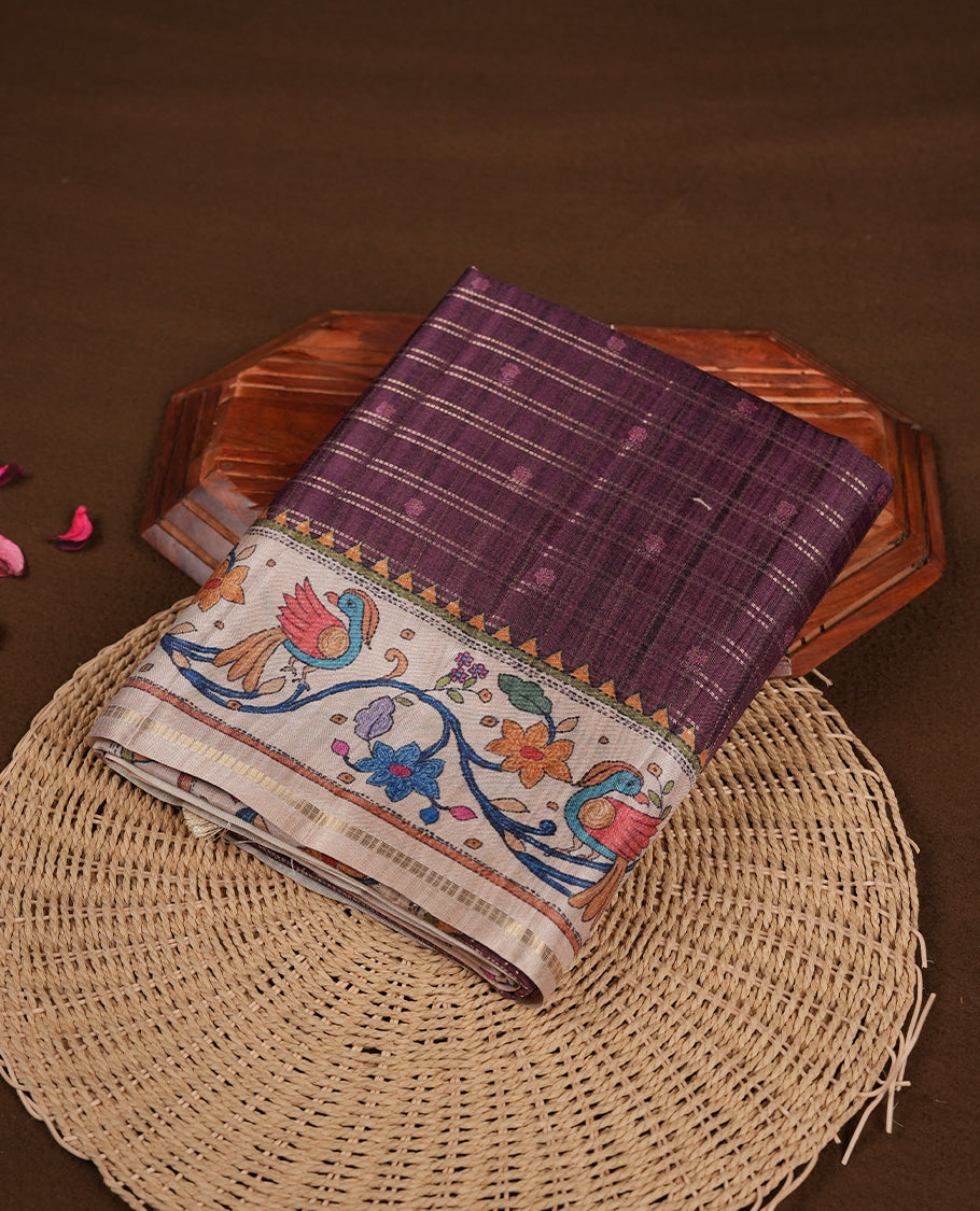 Maroon colour semi tusser silk saree featuring gold zari check pattern with floral butti motifs, with contrast floral kodi & bird pattern and paired with matching blouse.